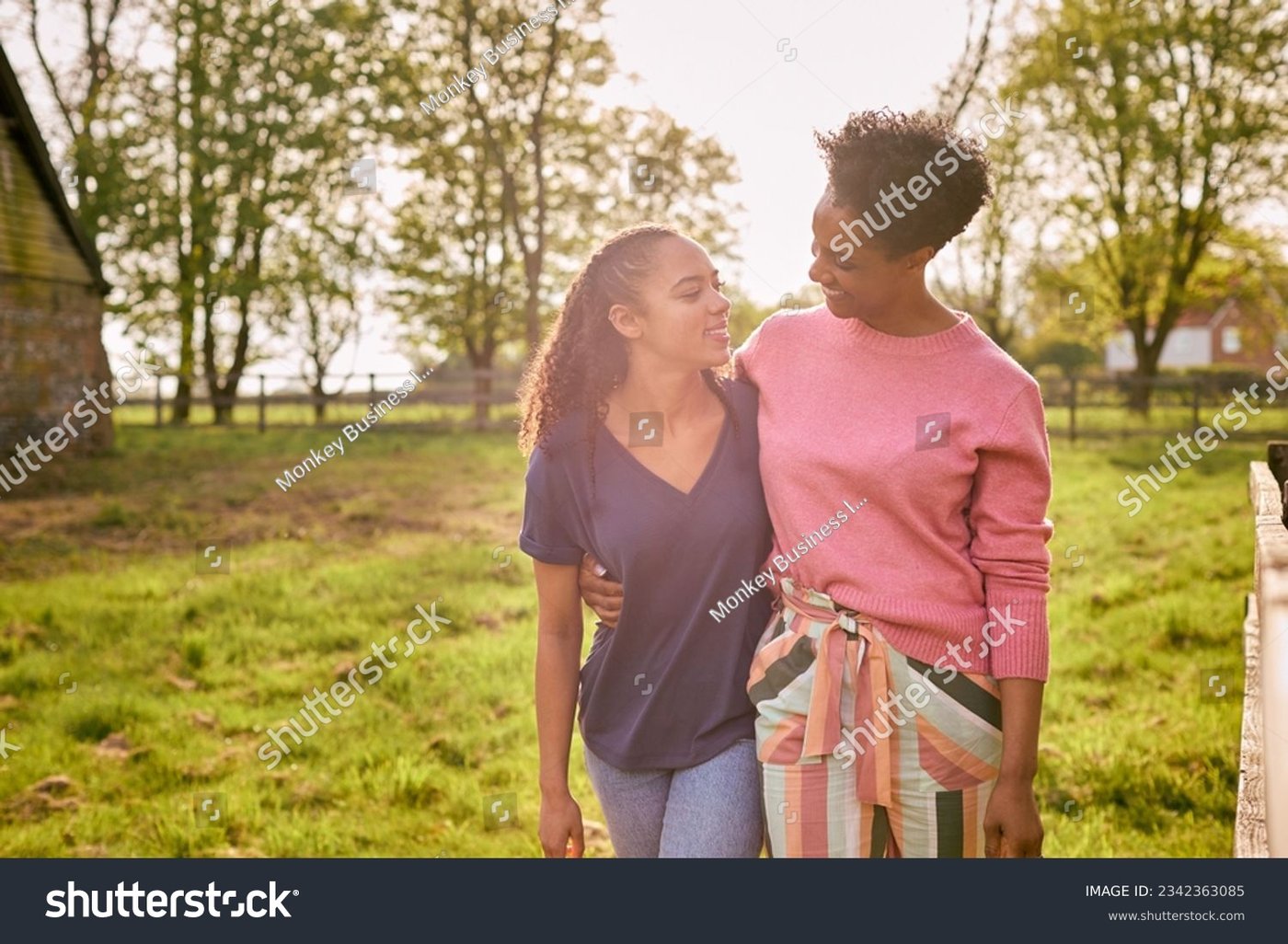 A parent and child together at golden hour
